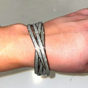 Silver Bracelet which is 6 intertwined metal bracelets in one